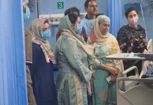 Health Minister visits local hospital to check on ailing former MLA Dr. Ghulam Nabi Bhat